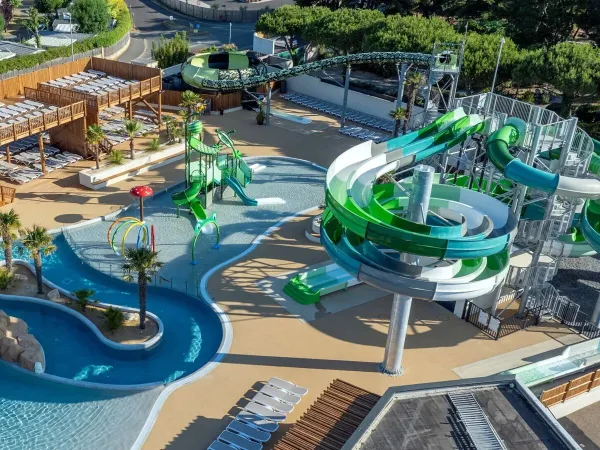 Renewed swimming pool with cool slides and water playground at Le Domaine du Clarys campsite.