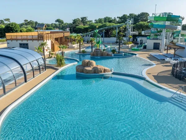 Overview swimming pool with new slides at Roan camping Le Domaine du Clarys.