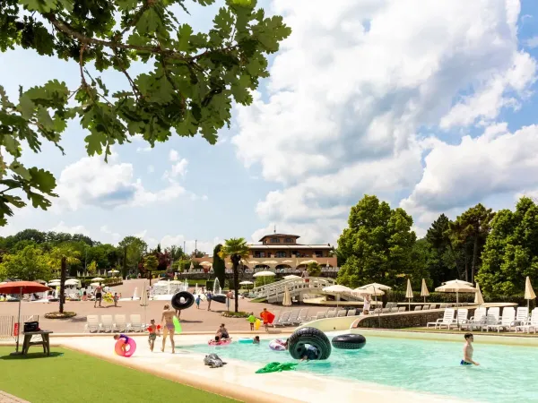 Children's pool with soft surface and sliding hills at Roan camping hu Norcenni Girasole village.