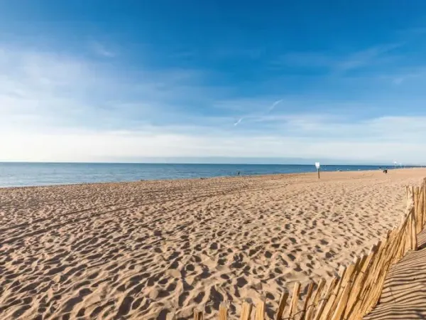 Beautiful sandy beach at Roan camping Le Serignan Plage.