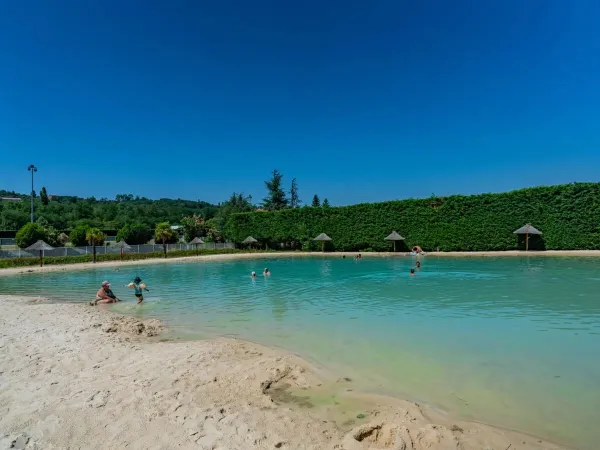 The lagoon pool paradise with beach at Roan campsite Chateau de Galaure.