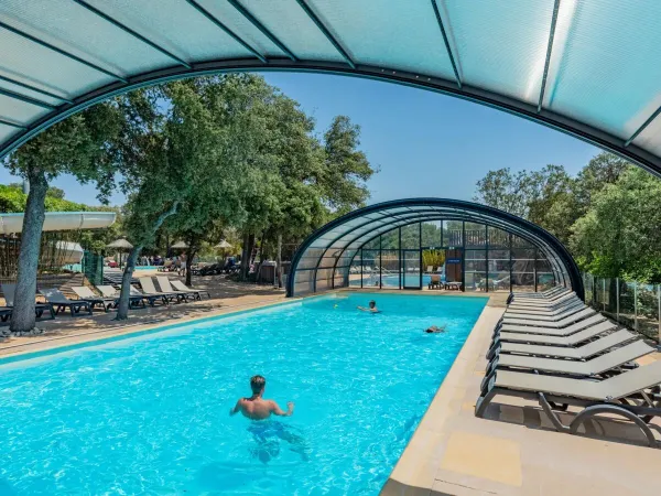 Covered swimming pool at Roan camping Domaine Massereau.