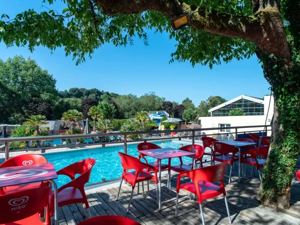 The terrace by the pool at Roan campsite Le Ty Nadan.