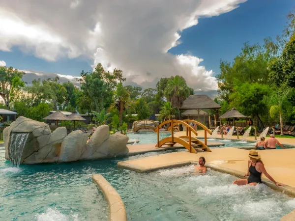 People enjoy themselves in the spa zone at Roan campsite Arinella Bianca.