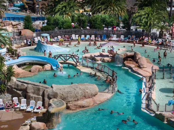 Guests swim in the pool at Roan campsite Les Sables d'Or.