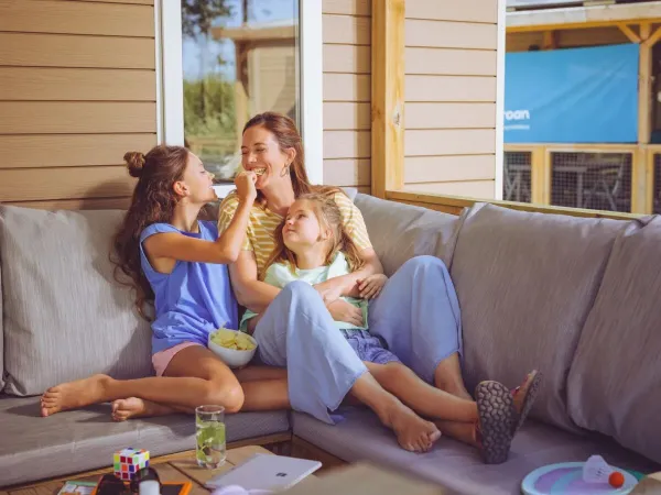 Mother and children enjoy themselves on Roan's lounge sofa.