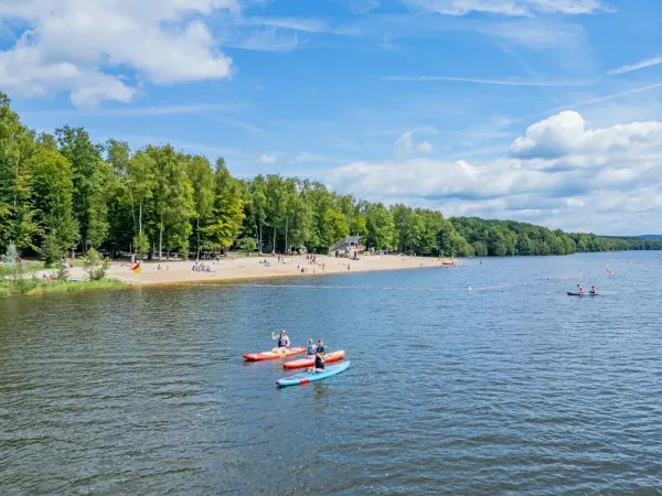 Canoeing on the lake at Roan camping Le Lac des Vieilles Forges.
