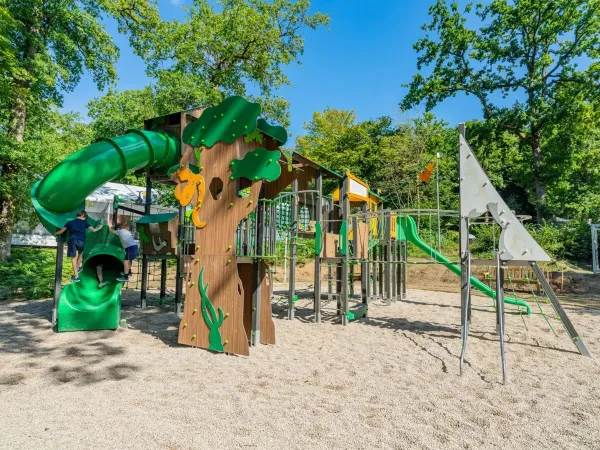 A fun playground with slide at Roan camping Le Lac des Vieilles Forges.