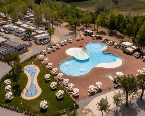Swimming pool and spray park at Roan camping Rimini Family Village.