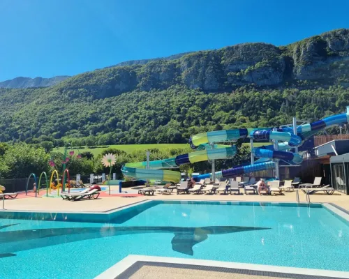 Swimming pool with slides at Roan camping L'Ideal.