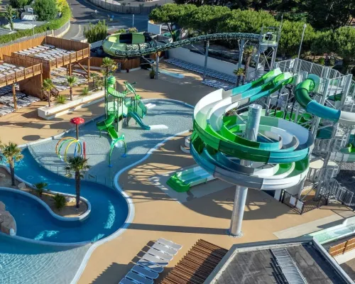 Renewed swimming pool with cool slides and water playground at Le Domaine du Clarys campsite.