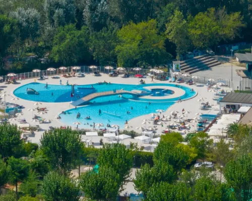 Drone shot of the swimming pool at Roan camping Adriano Family Collection.