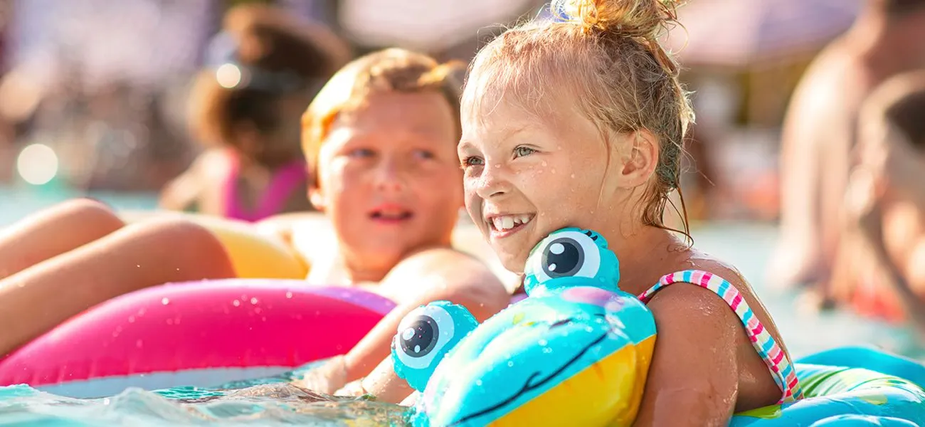 people in the pool at a Roan campsite.