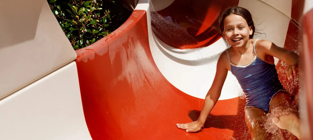 A girl on the slide at a Roan campsite near Friuli-Venezia Giulia.