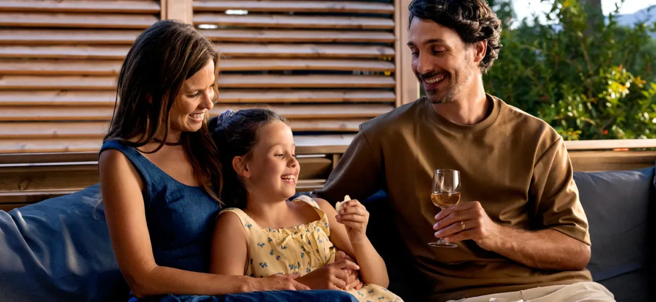 Family having dinner in the Roan mobile home.